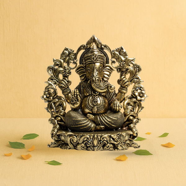 Brass Ganesha Idol sitting on Sofa Floral Arch 4" – Symbol of Divine Blessings